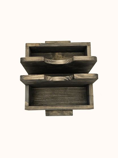 Eco-friendly salt and pepper wooden holder with compact bamboo jars and a sturdy base, ideal for kitchens and dining tables.

